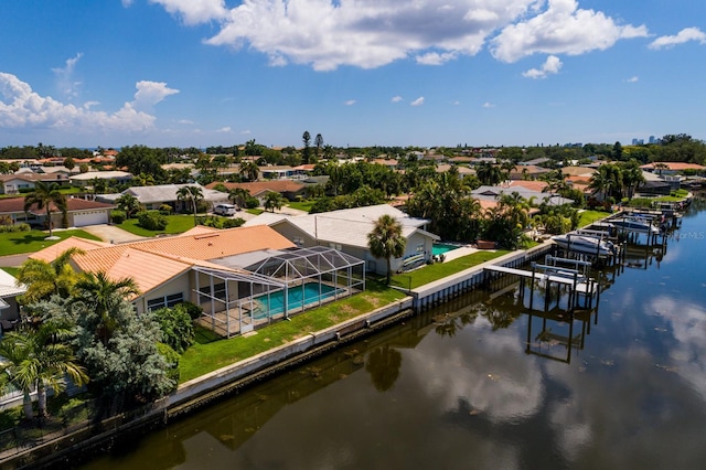 bird's eye view featuring a water view and a residential view