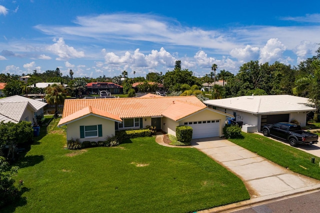 single story home featuring an attached garage, a tiled roof, driveway, stucco siding, and a front yard