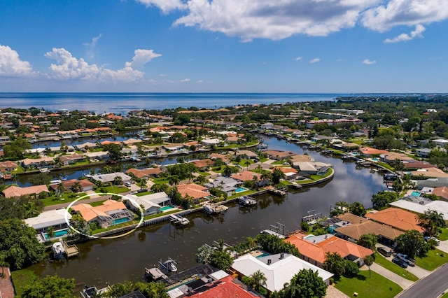 birds eye view of property featuring a water view and a residential view