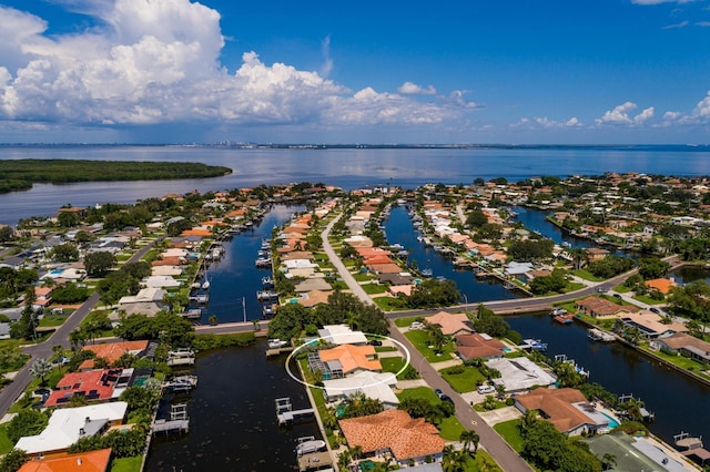 bird's eye view featuring a water view and a residential view