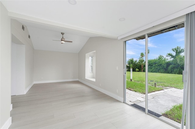 unfurnished room with light wood finished floors, ceiling fan, baseboards, and lofted ceiling