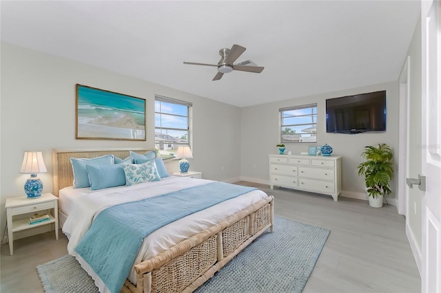 bedroom featuring baseboards and ceiling fan