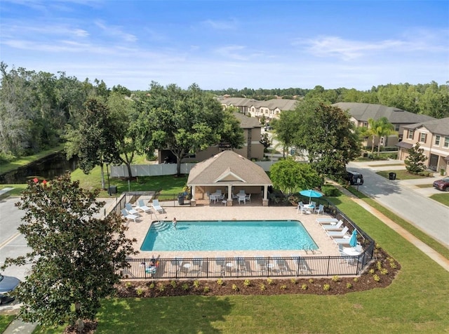 view of pool featuring a yard