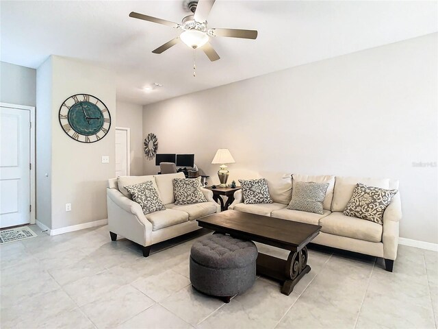 tiled living room featuring ceiling fan