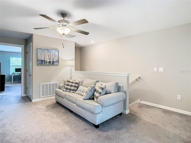 living room with carpet flooring and ceiling fan