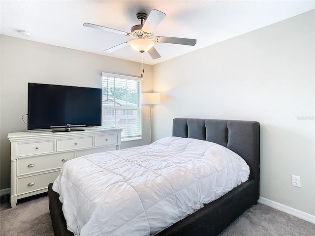 bedroom featuring ceiling fan and light colored carpet