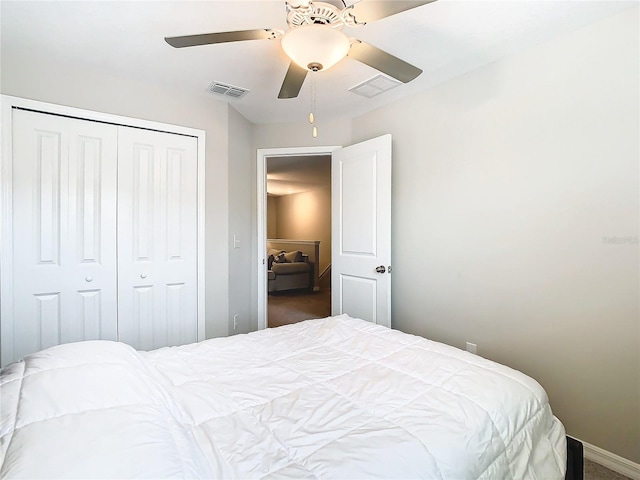 bedroom featuring ceiling fan, carpet flooring, and a closet