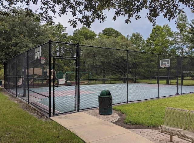 view of tennis court with a lawn and basketball court