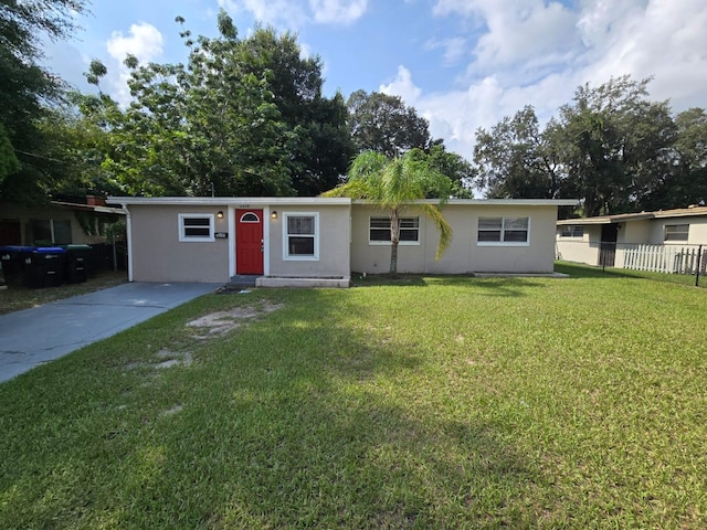 single story home with a front lawn