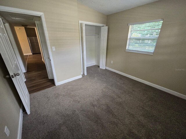 unfurnished bedroom featuring a closet and carpet