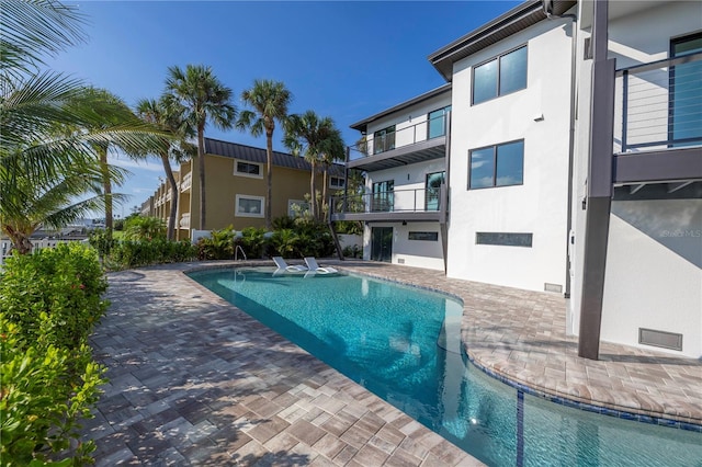 view of pool featuring a patio area