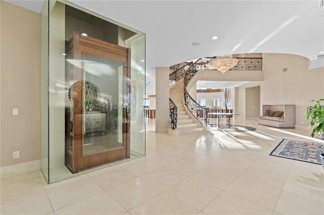 tiled entrance foyer with recessed lighting, baseboards, and stairs