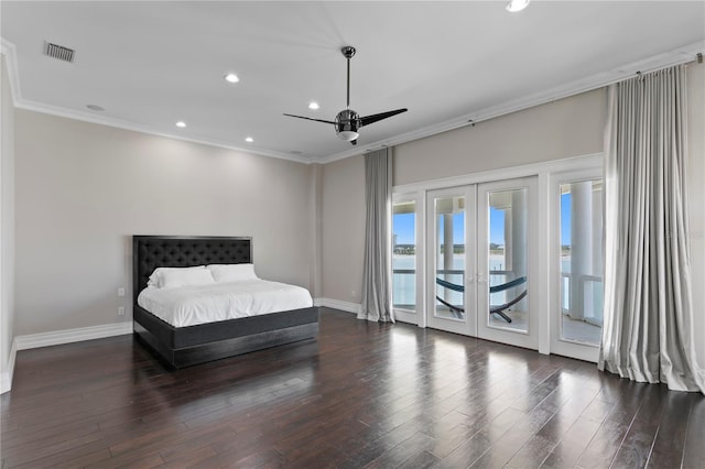 bedroom with baseboards, visible vents, ornamental molding, wood finished floors, and access to exterior