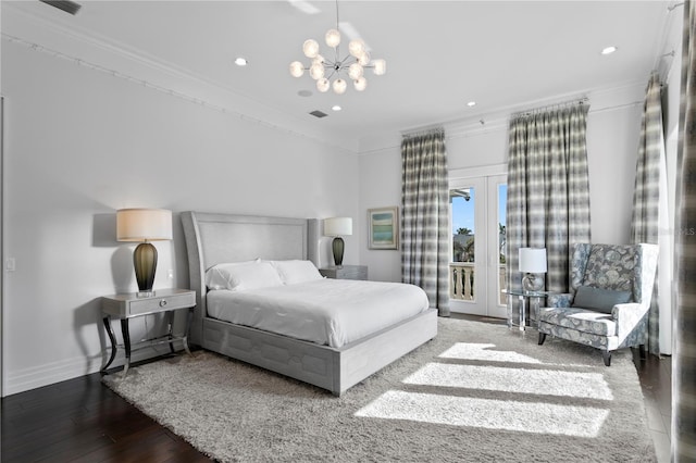 bedroom with baseboards, visible vents, hardwood / wood-style floors, access to outside, and crown molding