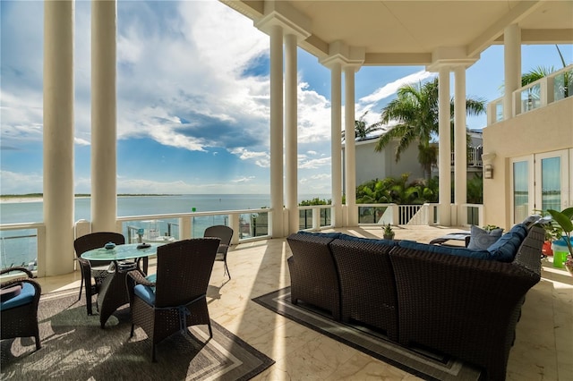 view of patio / terrace with outdoor dining space and a water view