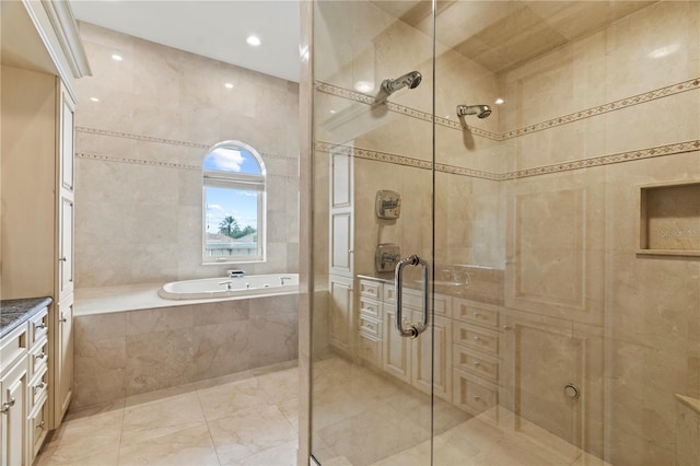 full bathroom featuring a stall shower, tile walls, and a bath