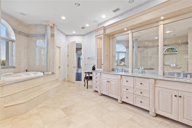 bathroom with ornamental molding, a sink, a shower stall, and double vanity