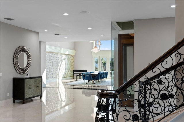 interior space with stairway, visible vents, and recessed lighting