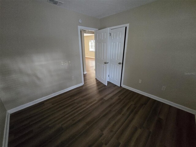 spare room with hardwood / wood-style flooring