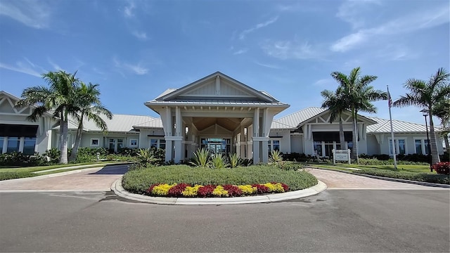 view of building exterior with decorative driveway