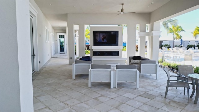 view of patio featuring ceiling fan