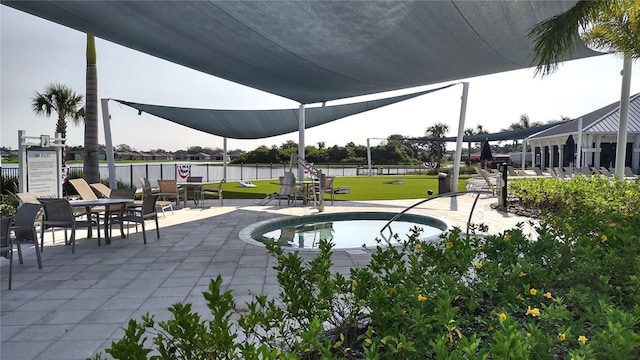 view of property's community with a patio area, a yard, and fence