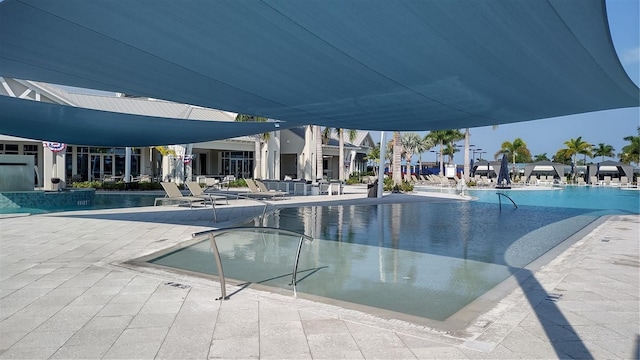 pool with a patio area