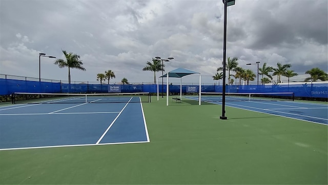 view of tennis court with fence