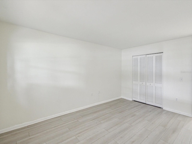 spare room featuring light wood-type flooring