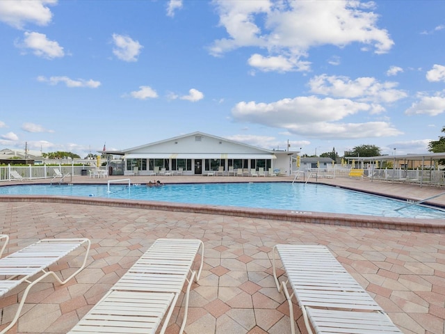 view of swimming pool with a patio area