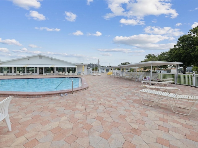 view of swimming pool with a patio area