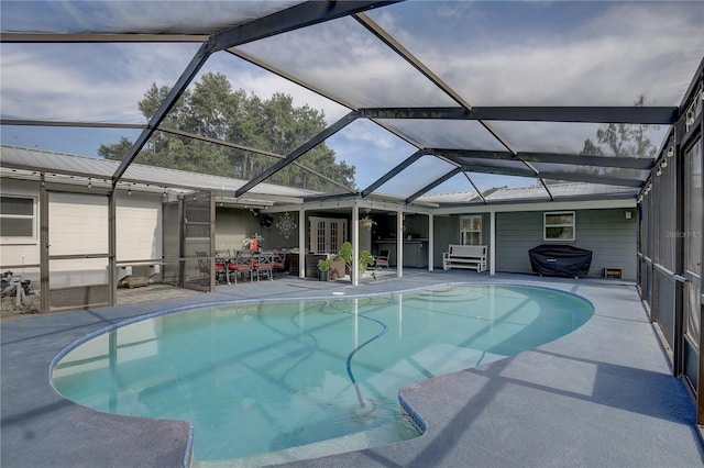 view of pool featuring a patio and a lanai