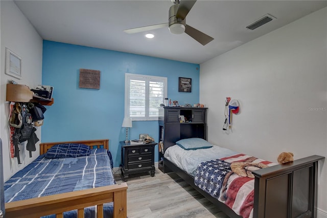 bedroom featuring ceiling fan and hardwood / wood-style flooring