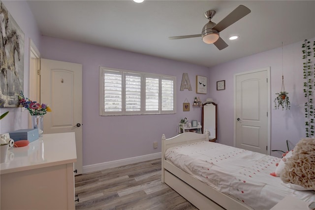 bedroom featuring light wood-type flooring and ceiling fan