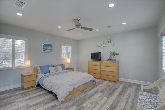 bedroom featuring light wood-type flooring and ceiling fan