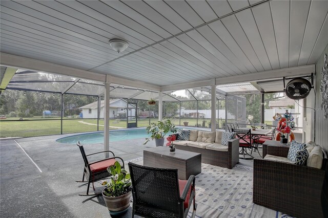 sunroom / solarium with a swimming pool