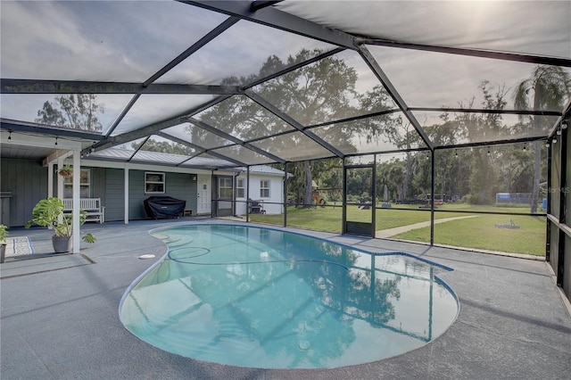 view of pool featuring a lanai, a patio area, and a yard