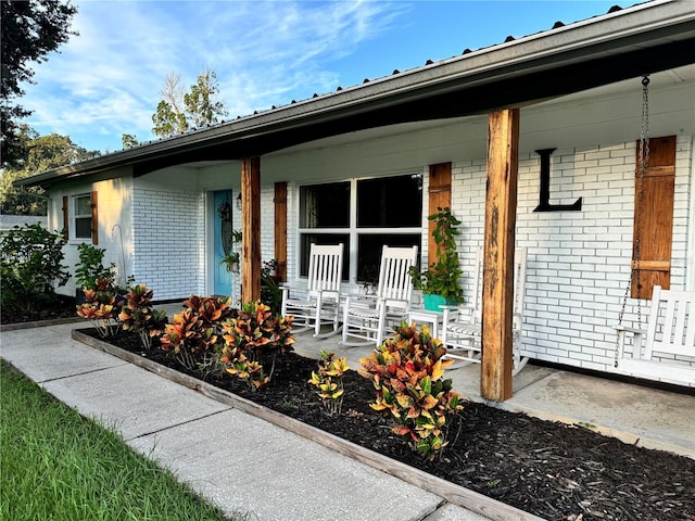 doorway to property featuring covered porch