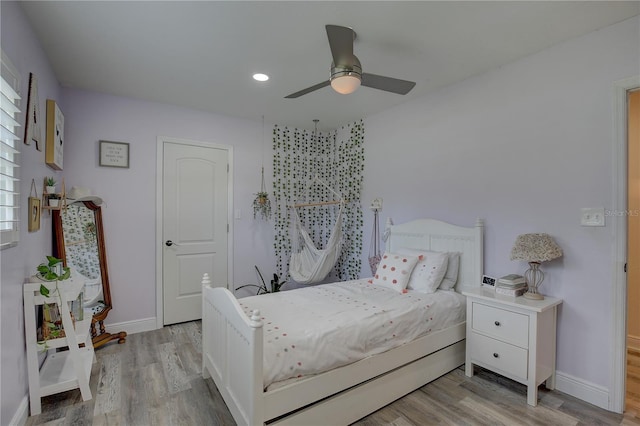 7809 Alafia Dr, Riverview, FL 33578 - bedroom featuring wood finished floors, baseboards, a ceiling fan, and recessed lighting