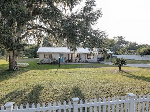 7809 Alafia Dr, Riverview, FL 33578 - single story home featuring a porch, metal roof, and concrete driveway