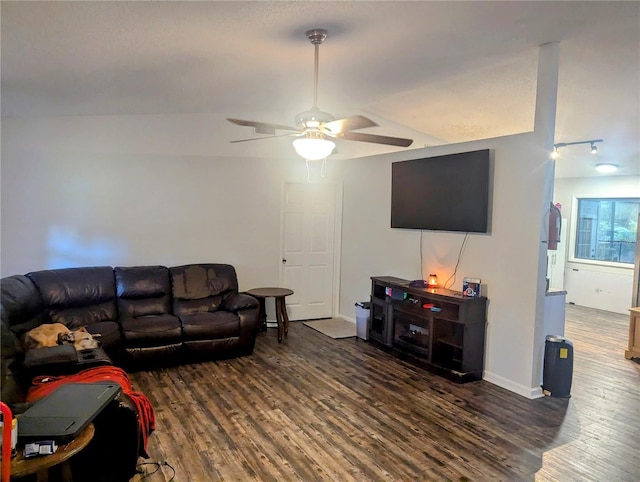 living room with lofted ceiling, ceiling fan, and dark hardwood / wood-style floors