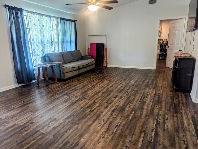 living room with ceiling fan and dark hardwood / wood-style floors