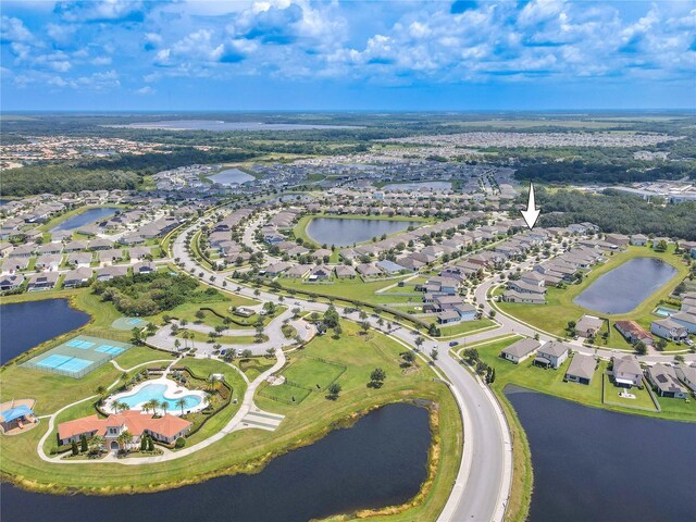 birds eye view of property with a water view