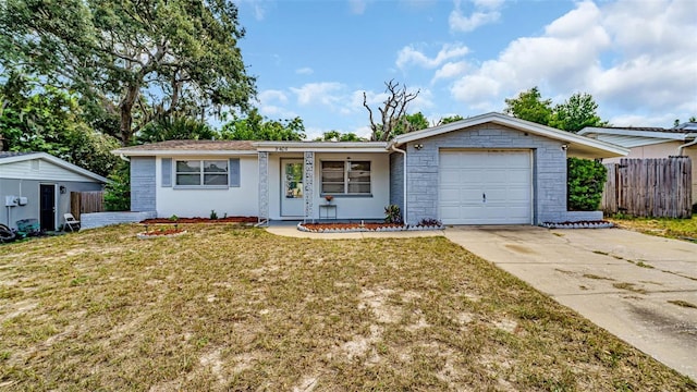 single story home with a front lawn, a garage, and a storage unit