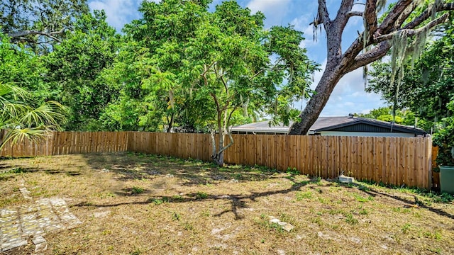 view of yard with a fenced backyard