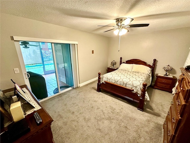 bedroom with access to exterior, ceiling fan, carpet, and a textured ceiling