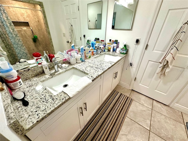 bathroom with tile patterned flooring and vanity