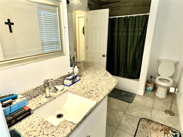 bathroom featuring tile patterned flooring, vanity, and toilet