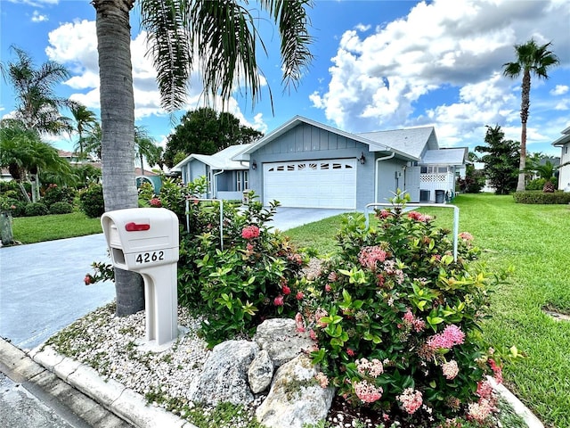 view of front of property with a garage and a front yard