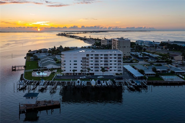 aerial view at dusk with a water view